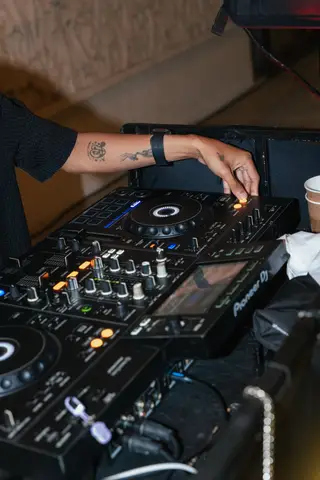 The DJ’s hands on the decks